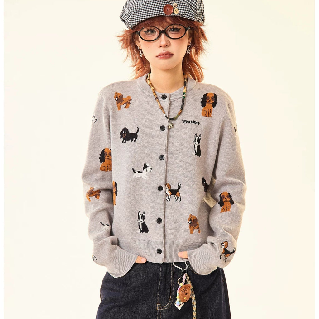 Adorable grey knit cardigan featuring a charming puppy print design. This cropped style offers a playful, contemporary look perfect for casual outings or layering. Crafted from soft, comfortable knit fabric that moves with you throughout the day. The cropped length pairs effortlessly with high-waisted bottoms for a modern silhouette. Ideal for animal lovers seeking a cozy yet stylish piece to add to their wardrobe.