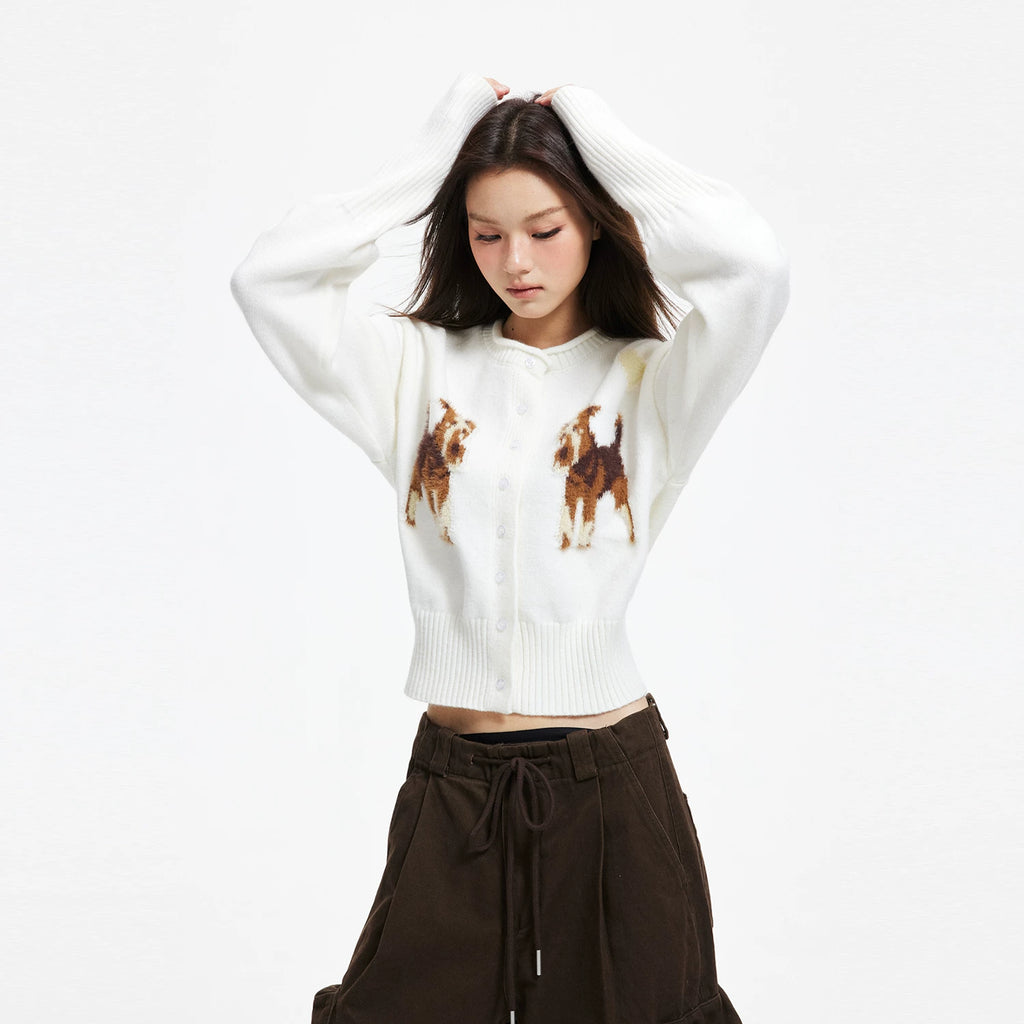 APEA's cozy puppy jacquard knit cardigan in a cropped, waist-cinching silhouette — an effortlessly chic layering piece for fall and winter.