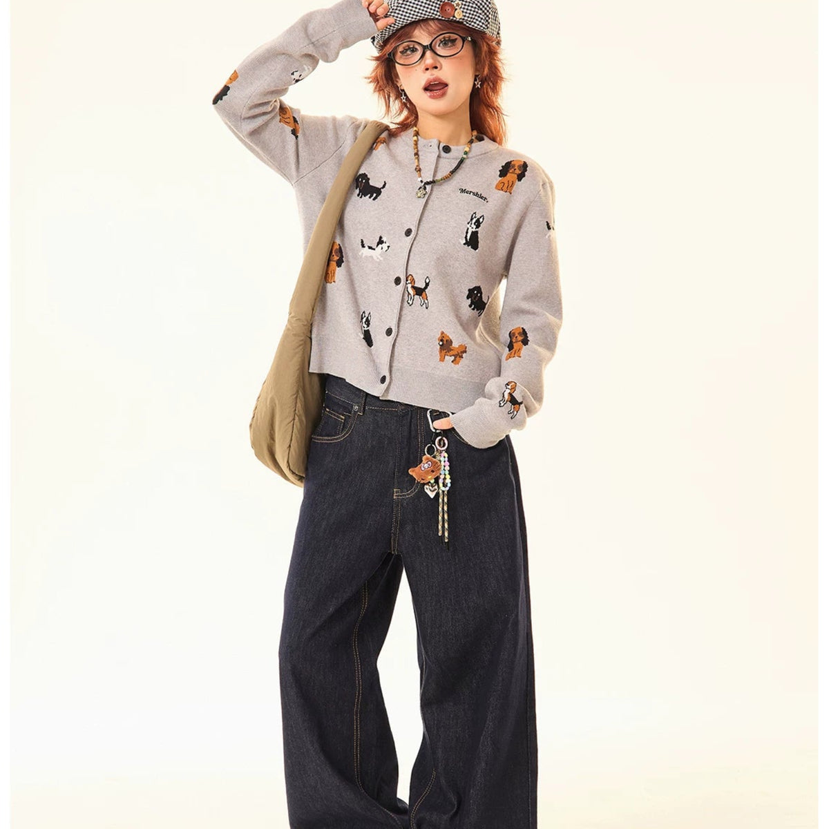 Adorable grey knit cardigan featuring a charming puppy print design. This cropped style offers a playful, contemporary look perfect for casual outings or layering. Crafted from soft, comfortable knit fabric that moves with you throughout the day. The cropped length pairs effortlessly with high-waisted bottoms for a modern silhouette. Ideal for animal lovers seeking a cozy yet stylish piece to add to their wardrobe.