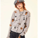 Adorable grey knit cardigan featuring a charming puppy print design. This cropped style offers a playful, contemporary look perfect for casual outings or layering. Crafted from soft, comfortable knit fabric that moves with you throughout the day. The cropped length pairs effortlessly with high-waisted bottoms for a modern silhouette. Ideal for animal lovers seeking a cozy yet stylish piece to add to their wardrobe.