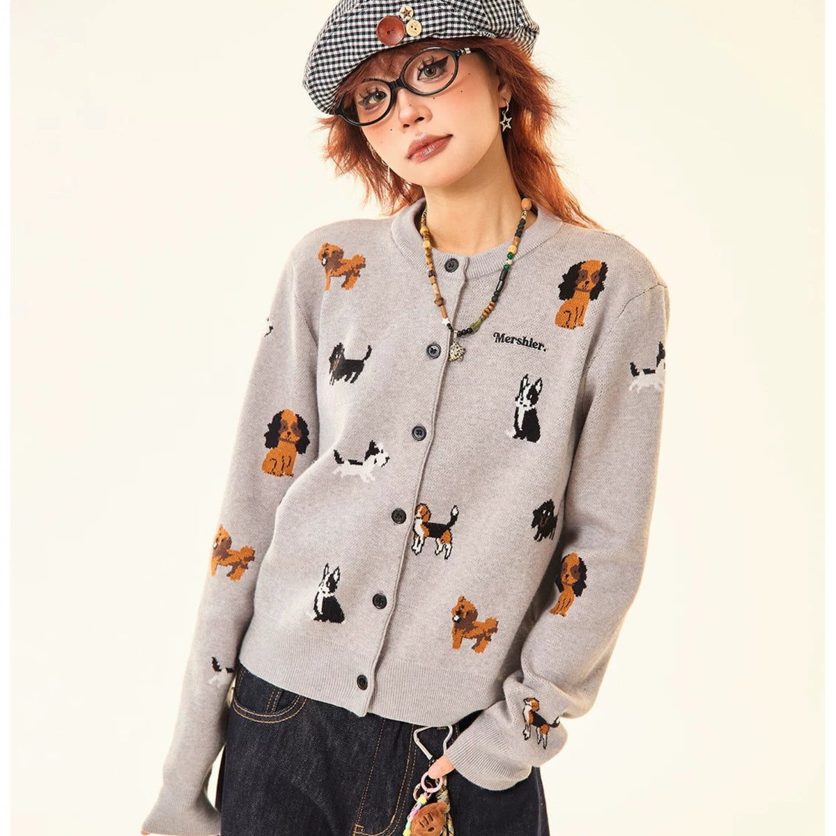 Adorable grey knit cardigan featuring a charming puppy print design. This cropped style offers a playful, contemporary look perfect for casual outings or layering. Crafted from soft, comfortable knit fabric that moves with you throughout the day. The cropped length pairs effortlessly with high-waisted bottoms for a modern silhouette. Ideal for animal lovers seeking a cozy yet stylish piece to add to their wardrobe.